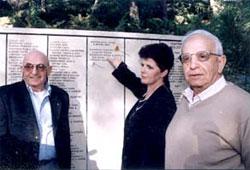 Shlomo (left) and Joseph Adler, with Ivanna Chopko, daughter of Michal Radukhivski and granddaughter of Michal and Maria Radukhivski, in the Garden of the Righteous Among the Nations