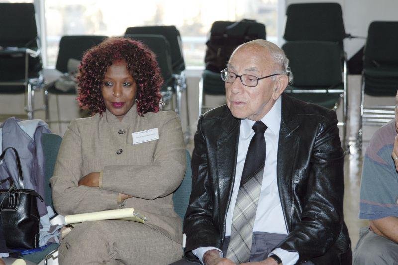 Holocaust survivor Zvi Michaeli and Rwandan genocide survivor Esperesa Motiysa at the joint survivors session held at Yad Vashem 