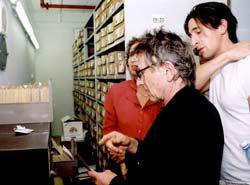 Roman Polanski examines his father's card from the Mauthausen registry in the Yad Vashem Archives