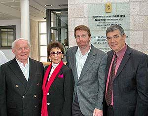 David and Fela Shapell, son Ben, together with Avner Shalev (right). In the background is the David and Fela Shapell Family Shoah and Heroism Study Center for Youth