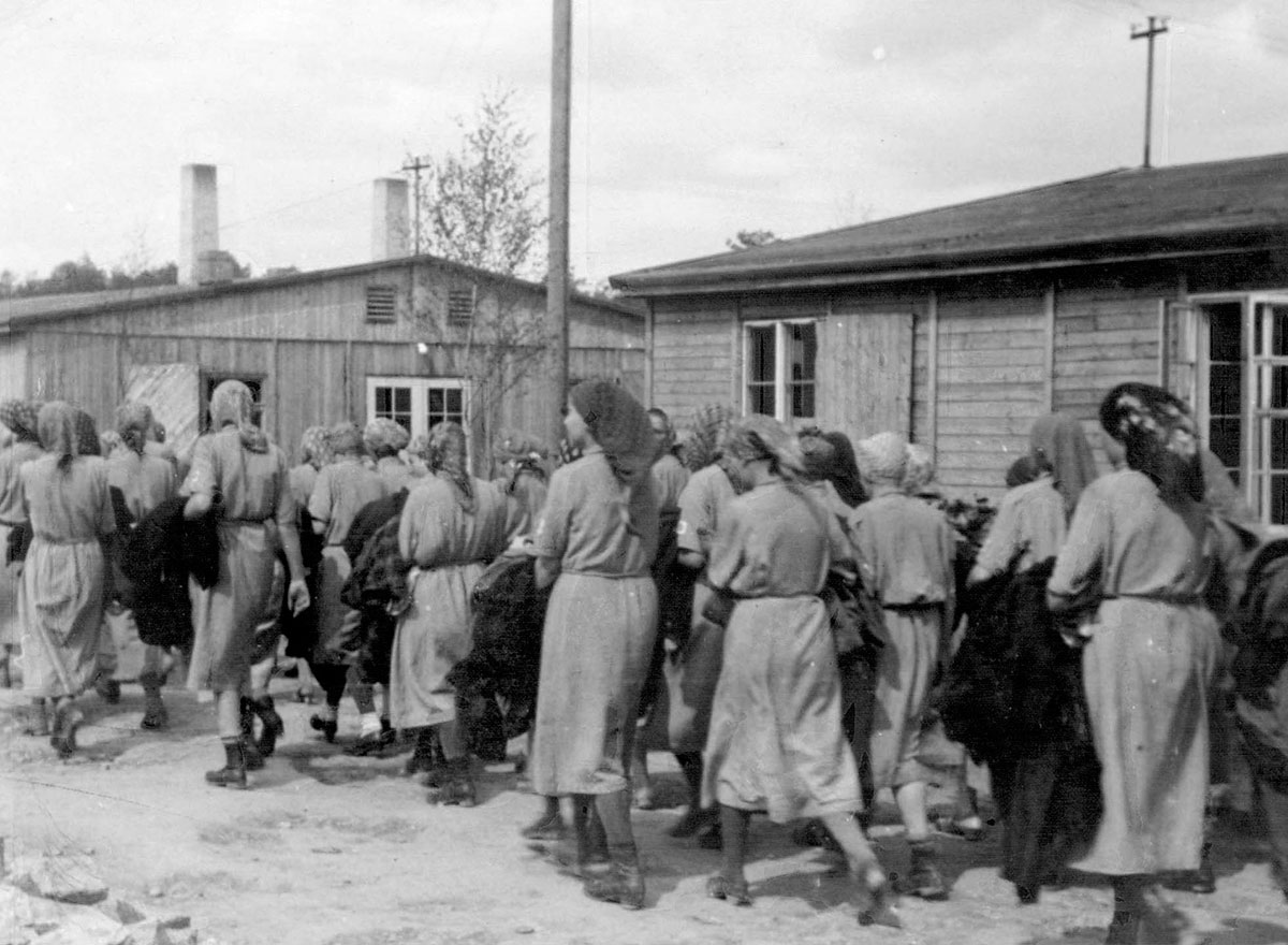 After having been shaved, these Jewish women are being taken to their barracks