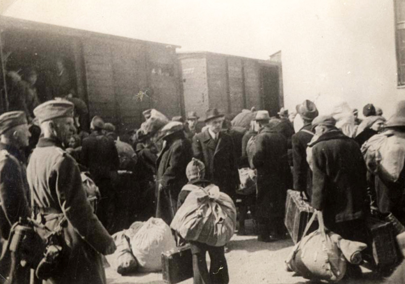 Expelled Thracian Jews boarding trains to extermination camps, March 1943